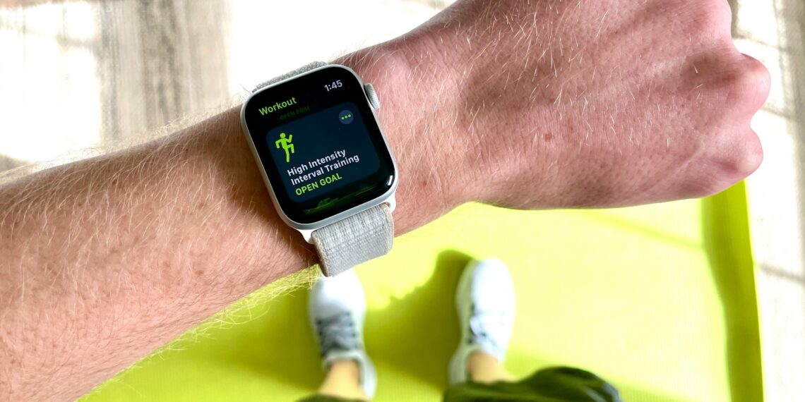 silver aluminum case apple watch with white sport band