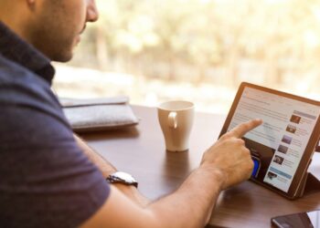 man holding tablet computer
