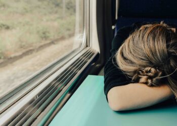 sleeping woman in train at daytime