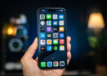 A person holding a cell phone in their hand