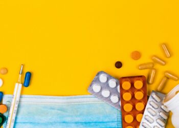 white and black dice on orange surface